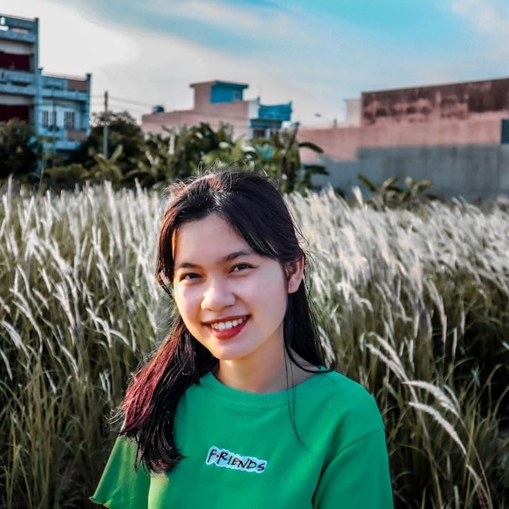 Kaveri Mehta, Lead Design Curator at StoneGrovePath, reviewing corporate floral arrangements